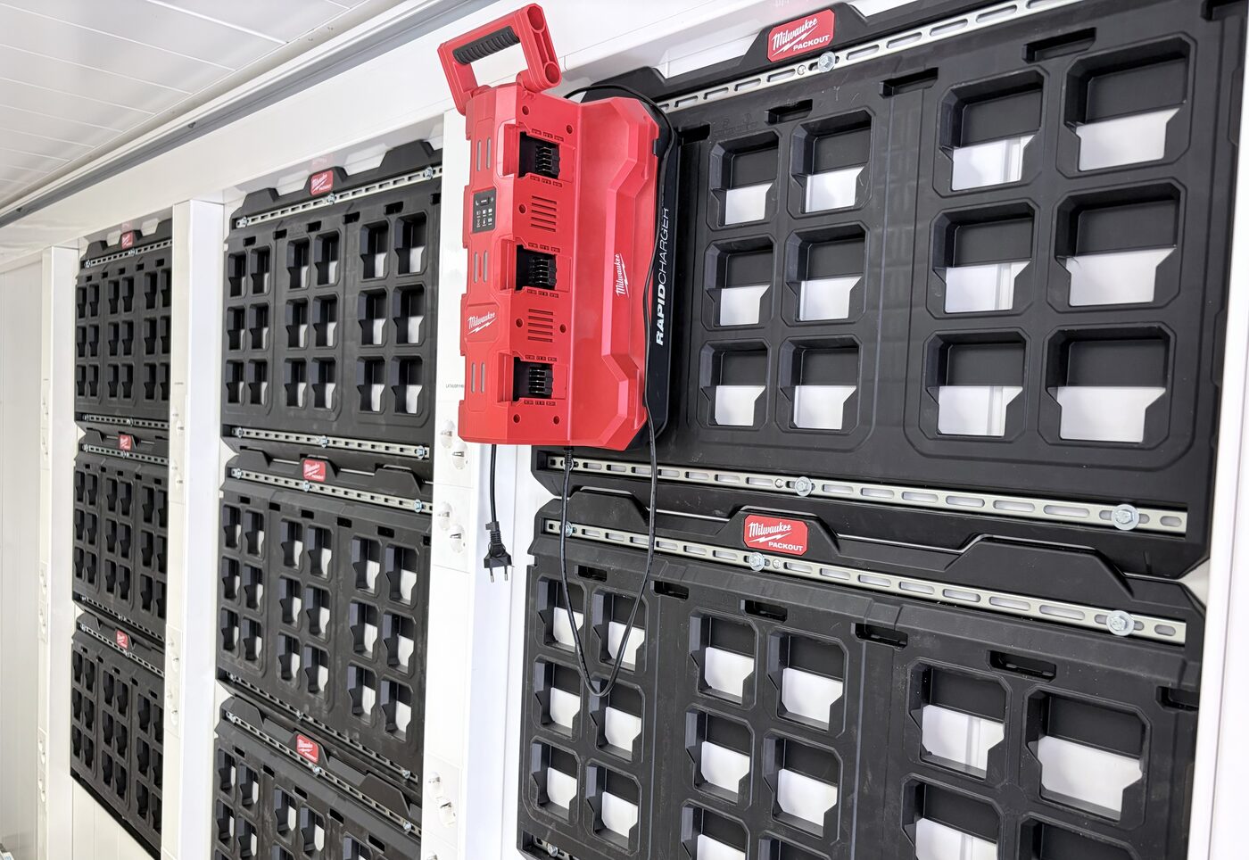 Interior wall fitted with multiple battery charging stations