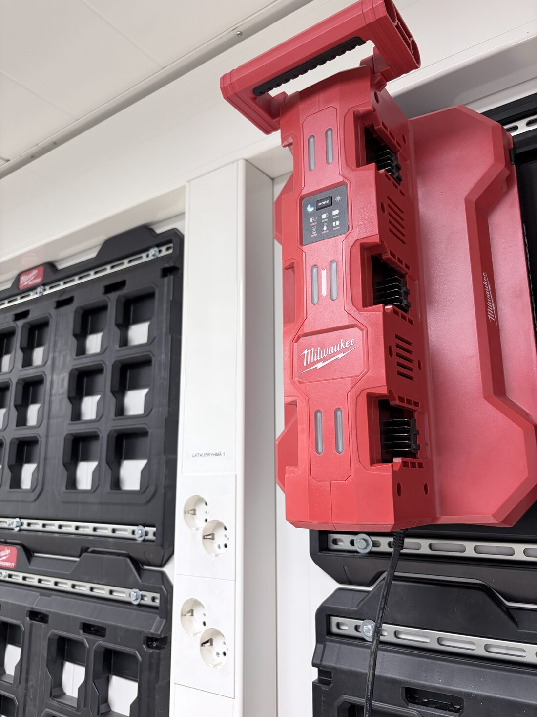 Close-up of a multi-bay rapid battery charger