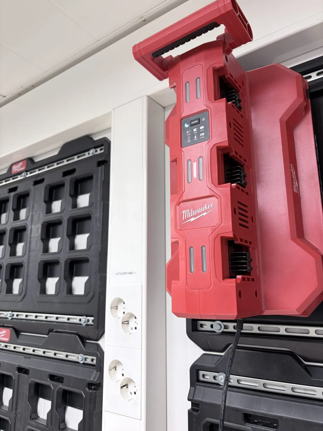 Close-up of a multi-bay rapid battery charger