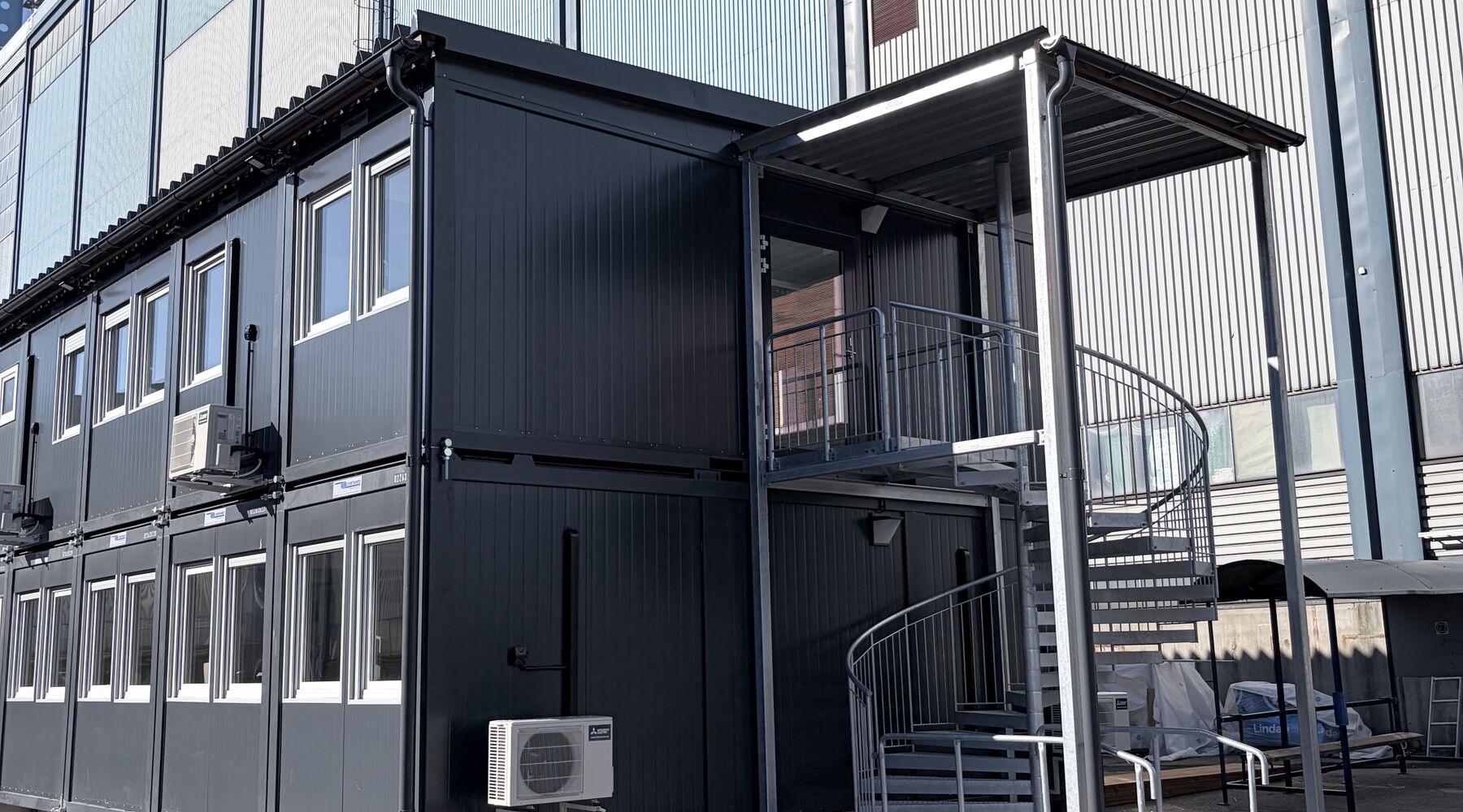 Two-storey modular office complex with galvanised external stairs